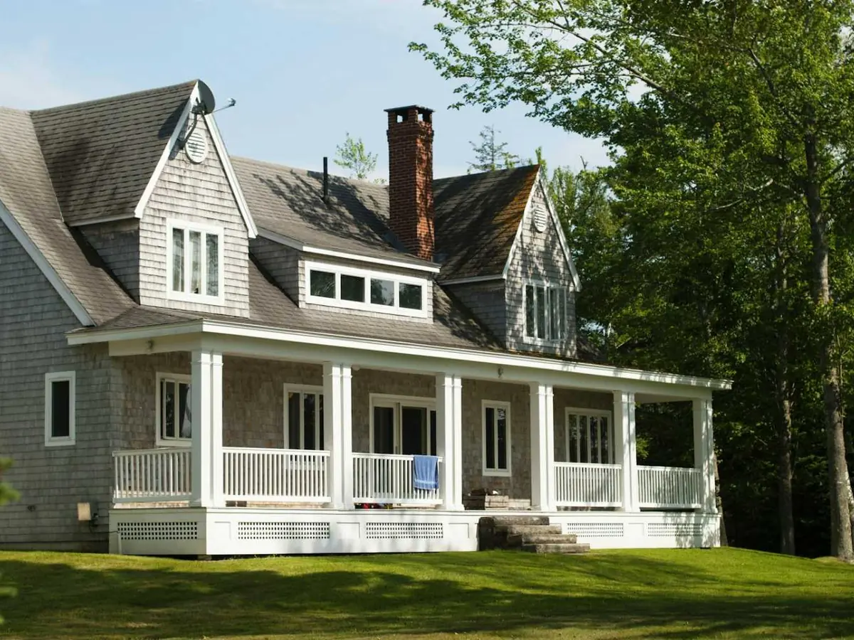 Shingled house with a wraparound porch